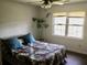 Bedroom with a large window, decor, and comfortable bedding provides a peaceful retreat at 3546 Mount Vernon Ct, Lawrenceville, GA 30044