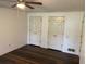 This bedroom showcases hardwood floors and two closets for ample storage at 3546 Mount Vernon Ct, Lawrenceville, GA 30044