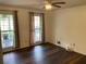 Bright bedroom with wood floors, two windows and a ceiling fan at 3546 Mount Vernon Ct, Lawrenceville, GA 30044