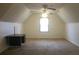 Spacious bonus room with desk, large window, and a ceiling fan at 3546 Mount Vernon Ct, Lawrenceville, GA 30044