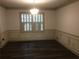 Dining area with dark wood flooring and natural lighting at 3546 Mount Vernon Ct, Lawrenceville, GA 30044