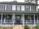 Inviting front porch with classic columns and space for relaxing at 3546 Mount Vernon Ct, Lawrenceville, GA 30044