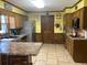 Spacious kitchen with tile floors, stainless steel appliances, and ample counter space at 3546 Mount Vernon Ct, Lawrenceville, GA 30044