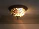 Close-up of a decorative stained-glass ceiling light fixture at 3546 Mount Vernon Ct, Lawrenceville, GA 30044