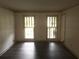 Spacious living area with dark wood flooring and natural lighting at 3546 Mount Vernon Ct, Lawrenceville, GA 30044