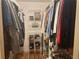 Organized walk-in closet with clothes hanging and a wire rack shelving unit at 3546 Mount Vernon Ct, Lawrenceville, GA 30044