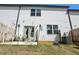 Private backyard with a small patio, complete with outdoor seating and lush green grass at 5123 Tulip Sq, Acworth, GA 30101