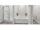 Modern bathroom featuring a soaking tub and glass-enclosed shower at 5123 Tulip Sq, Acworth, GA 30101