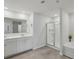 Modern bathroom featuring a double sink vanity and glass-enclosed shower at 5123 Tulip Sq, Acworth, GA 30101
