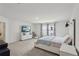 Spacious bedroom with large screen television on the dresser and a window view to the outside at 5123 Tulip Sq, Acworth, GA 30101