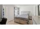 Neutral bedroom with a large bed, two nightstands, and a chest of drawers at 5123 Tulip Sq, Acworth, GA 30101