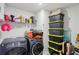 Well-organized laundry room with modern washer and dryer and storage containers at 5123 Tulip Sq, Acworth, GA 30101