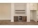 Bar area features wood cabinets, open shelves, marble countertops, and a wine cooler at 560 Fisher Dr # 48, Alpharetta, GA 30009