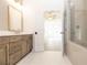 Elegant bathroom featuring a wood vanity with a mirror and an open doorway at 560 Fisher Dr # 48, Alpharetta, GA 30009