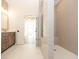 Well-lit bathroom with a vanity, walk-in shower, and neutral color palette at 560 Fisher Dr # 48, Alpharetta, GA 30009