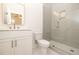 Bathroom showcasing a frameless glass shower, white vanity, gold fixtures, and tile floors at 560 Fisher Dr # 48, Alpharetta, GA 30009