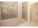 Contemporary bathroom with a sleek glass-enclosed shower and neutral herringbone tile at 560 Fisher Dr # 48, Alpharetta, GA 30009