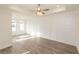 Spacious bedroom with wainscoting, tray ceiling, and wood flooring at 560 Fisher Dr # 48, Alpharetta, GA 30009