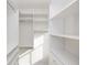 Walk-in closet with custom shelving and organization system at 560 Fisher Dr # 48, Alpharetta, GA 30009