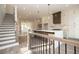 Open-concept kitchen showcasing an island, modern light fixtures, and stainless steel appliances at 560 Fisher Dr # 48, Alpharetta, GA 30009