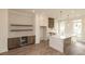 Spacious kitchen and bar area features wood floors, marble countertops, and stainless steel appliances at 560 Fisher Dr # 48, Alpharetta, GA 30009
