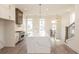 Well-lit kitchen boasting a quartz island, modern cabinets, and a stainless-steel range at 560 Fisher Dr # 48, Alpharetta, GA 30009