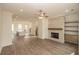 Expansive living area connects the kitchen, dining, and living spaces with wood flooring at 560 Fisher Dr # 48, Alpharetta, GA 30009