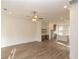 Open-concept living space features wood floors, a fireplace, bar area, and kitchen at 560 Fisher Dr # 48, Alpharetta, GA 30009