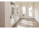 Bright living room with lots of light, wood floors, and white trim at 560 Fisher Dr # 48, Alpharetta, GA 30009