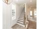 Staircase featuring wood treads, white risers, and a black iron railing at 560 Fisher Dr # 48, Alpharetta, GA 30009