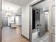 Updated bathroom features a tiled shower, modern fixtures, and patterned floors at 1074 Peachtree Ne Walk # 115, Atlanta, GA 30309