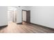 Bedroom with hardwood floors leading to closet and bathroom at 1074 Peachtree Ne Walk # 115, Atlanta, GA 30309