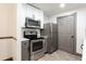 Updated kitchen features stainless steel appliances and modern design at 1074 Peachtree Ne Walk # 115, Atlanta, GA 30309