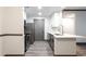 Modern kitchen boasts stainless steel appliances, white countertops, and gray cabinets at 1074 Peachtree Ne Walk # 115, Atlanta, GA 30309