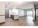 Open-concept living and kitchen area with stainless steel appliances and hardwood floors at 1074 Peachtree Ne Walk # 115, Atlanta, GA 30309