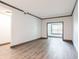 Bright, open living room with hardwood floors and large window at 1074 Peachtree Ne Walk # 115, Atlanta, GA 30309