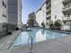 The community pool has clear water and a surrounding fence, offering a refreshing oasis for residents at 1074 Peachtree Ne Walk # 115, Atlanta, GA 30309