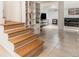 Basement living area with tile flooring, built-in shelving, a comfortable sofa, and a television for entertaining at 1424 Adele Sw Ave, Atlanta, GA 30314