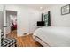 Bedroom with hardwood floors, white walls, and view into adjacent bedroom at 1424 Adele Sw Ave, Atlanta, GA 30314