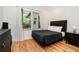 Comfortable bedroom with hardwood floors, large windows, and modern furnishings at 1424 Adele Sw Ave, Atlanta, GA 30314