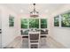Charming dining area with a wood table, comfortable seating, and a view of the outdoors at 1424 Adele Sw Ave, Atlanta, GA 30314