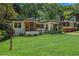 Beautifully maintained home with a vibrant green lawn and lovely landscaping at 1424 Adele Sw Ave, Atlanta, GA 30314
