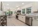 Eat-in kitchen with white cabinets, stainless steel appliances, granite countertops, and a view to the dining area at 1424 Adele Sw Ave, Atlanta, GA 30314