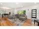 Bright and airy living room with hardwood floors, a comfortable sectional, and ample natural light at 1424 Adele Sw Ave, Atlanta, GA 30314