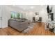 Inviting living room with a large sectional sofa, hardwood floors, and plenty of seating at 1424 Adele Sw Ave, Atlanta, GA 30314