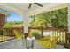 Charming front porch with patterned tile flooring, modern seating, and a view of the lush green landscape at 1424 Adele Sw Ave, Atlanta, GA 30314
