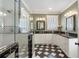 Open bathroom featuring an oversized shower, dual sink vanity, and classic tile flooring at 2759 Arbor Se Ave, Atlanta, GA 30317