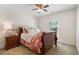 Bedroom with neutral decor, a dark wood bed frame, and a light-filled window at 2759 Arbor Se Ave, Atlanta, GA 30317