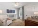 Charming Bedroom with shiplap walls, a crib, rocking chair, and a large window at 2759 Arbor Se Ave, Atlanta, GA 30317