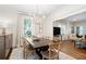 Dining room with modern chandelier, stylish furniture, and an open floor plan at 2759 Arbor Se Ave, Atlanta, GA 30317